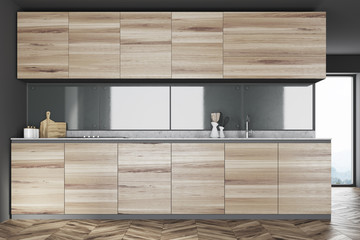 Gray kitchen interior, wooden counters