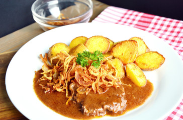 onion-topped roast beef with gravy is the favorite dish in Austria. (German name is Zwiebelrostbraten)