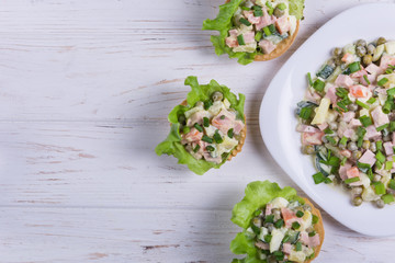 Traditional russian salad Olivier in tartlet