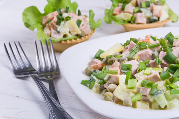 Traditional russian salad Olivier in tartlet