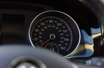 Close up shot of a speedometer in a car
