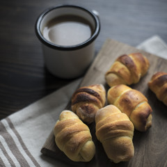 Mini croissants filled with cheese and coffee