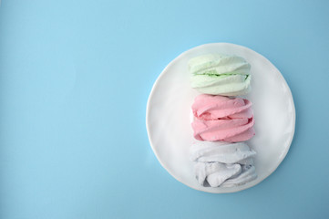 Fototapeta na wymiar Homemade sweets marshmallow . Delicate Zephyr on a pink background. Minimalistic background