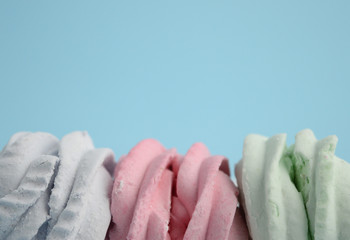 Homemade sweets marshmallow . Delicate Zephyr on a pink background. Minimalistic background