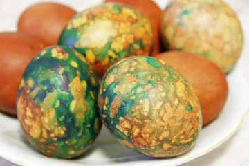 Colorful Easter Eggs On White Plate Placed By Heap