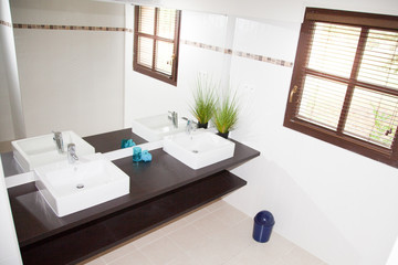 Fototapeta na wymiar Front View Of Two Outdoor Located Sinks With Modern Faucets On wood Table Top