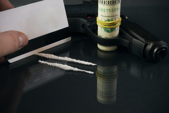Drug dealer Credit card, gun, road of cocacine, money, ammunition , gun