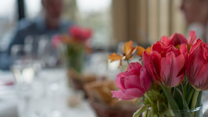 festive table with glasses and tulips
