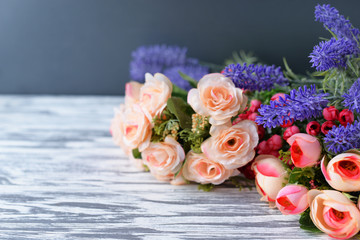 a bouquet with pink roses flowers on a light rural background in spring and summer on Mother's Day, a holiday on March 8 and Thanksgiving Day