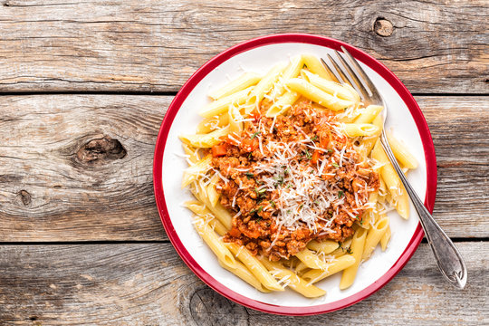 Pasta bolognese. Macaroni served with a classic italian bolognese stew sprinkled with Parmesan cheese