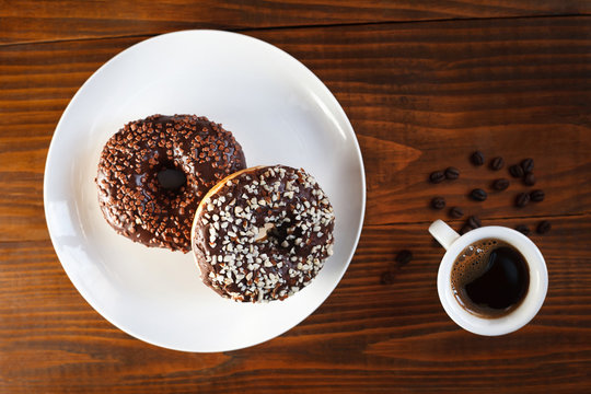 sugar glazed donuts with mug coffee