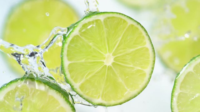 Water splash on sliced lime. Shot with high speed camera, phantom flex 4K. Slow Motion.