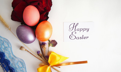 violet, gold and pink egg, red dry rose, dry branches on a white background, lace. a collage by...