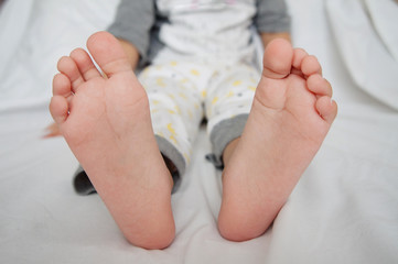 nurseries of a foot of legs. the sitting child