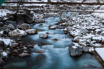 River flowing in snowfall