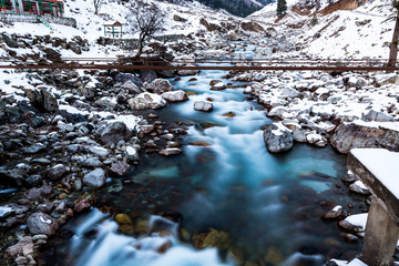 River flowing in snowfall