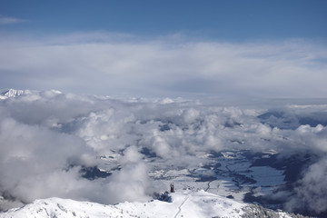 Fototapeta na wymiar View above clouds on a mountain peak