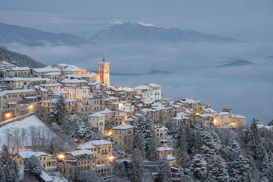 The little village of Santa Maria del Monte after a snowfall from Campo dei Fiori, Parco Campo dei Fiori, Varese, Lombardy, Italy, Europe