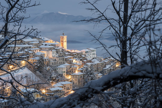 The Santa Maria del Monte framed by the braches after a snowfall in winter from Campo dei Fiori, Parco Campo dei Fiori, Varese, Lombardy, Italy, Europe