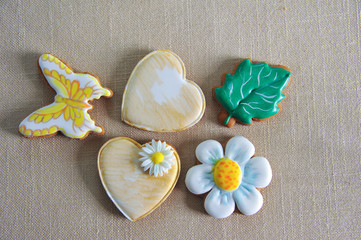 Gingerbread in the form of hearts, daisies and butterflies. Close-up
