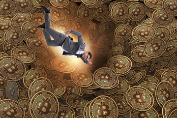 Fototapeta na wymiar Businessman falling into sinkhole of cryptocurrency bitcoin