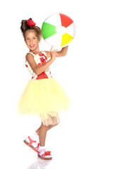 Little girl is playing with a ball