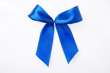 Blue satin textile ribbon tied in bow Isolated on white