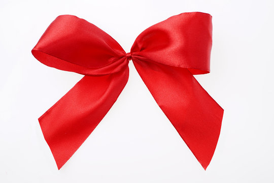 Red satin textile ribbon tied in bow Isolated on white