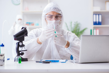 Two scientists working in the chemical lab