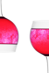 Food coloring diffuse in water inside wine glass area for slogan or advertising text message, on white background. Good concept.
