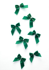 Green velvet bows on white