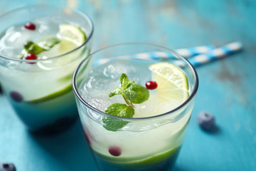 Glasses of fresh lemonade on table