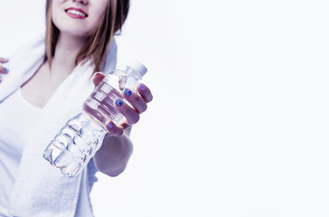 Beautiful woman with bottle of natural water. (food, healthy lifestyle, vitamins concept)