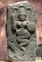 Indian ancient ruins of stone carved Hindu goddess naga  or snake devata 
