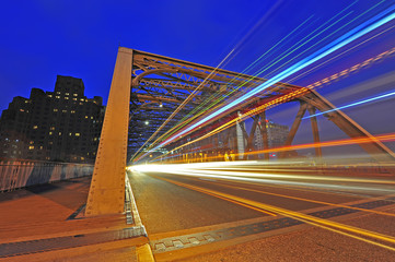 Naklejka premium Night traffic lights inside of the Garden Bridge of shanghai china.