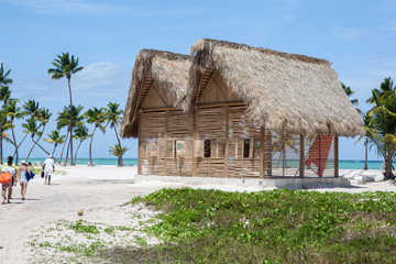 Fototapeta na wymiar Beach Hut, House in the Caribbean Sea with White Sand, Turquoise Water and Palm Trees, in Cap Cana, Dominican Republic