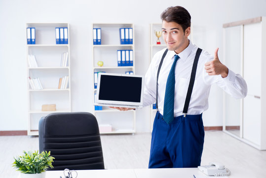 Young stylish businessman working in the office