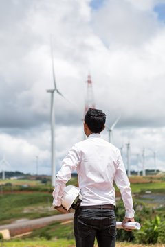 Male engineer checking and controlling with windmills for electric power production