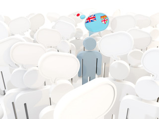 Man with flag of fiji in a crowd