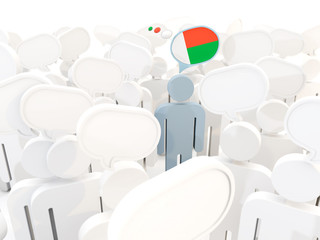 Man with flag of madagascar in a crowd