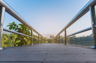 stainless steel bridge or pier at lake.