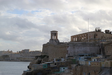 Fototapeta na wymiar View to Siege Bell War Memorial and fort St Angelo, Valletta, Malta