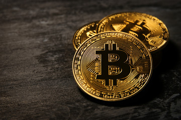 Golden Bitcoin over black background. Business concept.