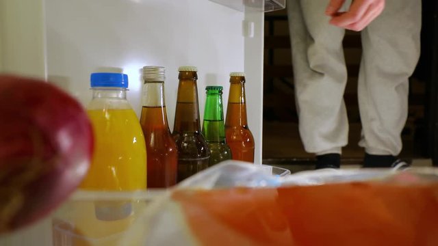 Taking a beer from the fridge