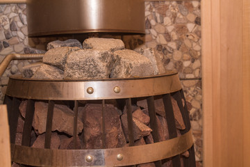 a heater in a sauna filled with stones