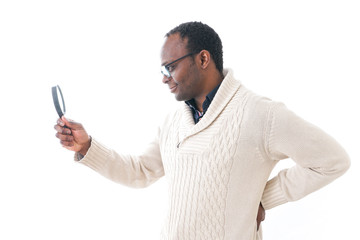 Man looking at something through a magnifying glass