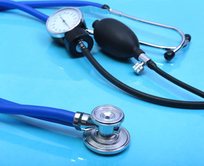 stethoscope, Red heart and blood pressure meter on white background. Selective focus.