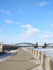 embankment in the snow and a frozen river