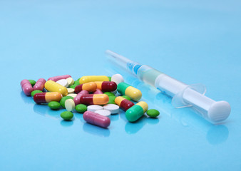 Syringe and Medical ampoules, vaccine on table.