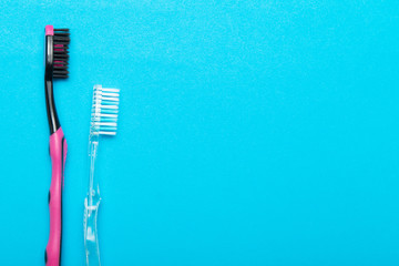 Hygienic toothbrush on a blue background. Copy space.